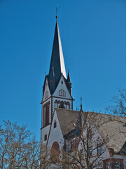 Gothic Church Spire Against Blue Sky