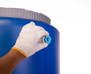 Plumber's Hand Wrapping White PTFE Thread Seal Tape Around a Bushing Reducer Coupling Pipe Fitting for Inlet