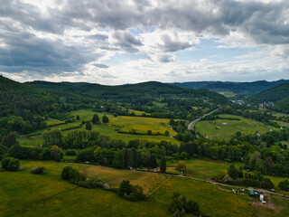 Obraz premium Scenic Landscape with Rolling Hills and Green Fields