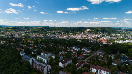 Aerial View of a Small Town with Hills and Trees