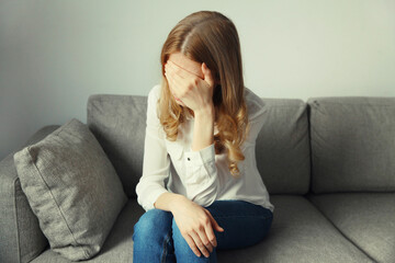 Upset sad crying woman while experiencing mental suffering, depression, fatigue, emotional stress