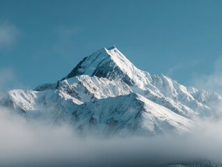 Clear Blue Sky Over Snow-Capped Mountain Peak Emerging from Low Clouds Winter Alpine Scenery
