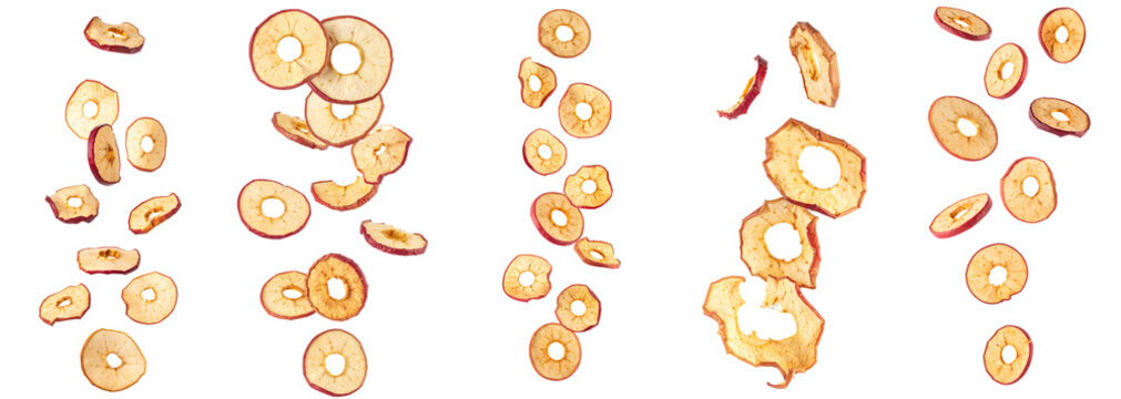 Dried apple rings falling, healthy fruit snack chips, dehydrated apples flying, sweet healthy food ingredient