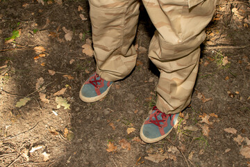 Man's feets in blue retro sneakers