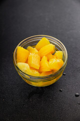 Pineapple canned chunks sweet fruit dessert tasty snack fresh delicious gourmet food background on the table rustic top view copy space keto and paleo diet vegetarian and vegan food