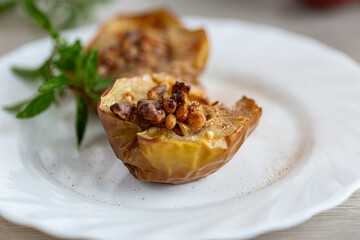 Warm homemade baked apples topped with walnuts and cinnamon