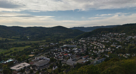 Aerial View of Town Surrounded by Green Hills