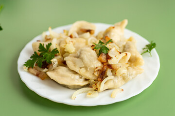 Traditional Ukrainian varenyky with golden onion and herbs