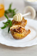 Traditional autumn dessert of apples filled with honey and nuts