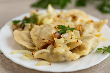 Ukrainian dumplings with potato filling and caramelized onions
