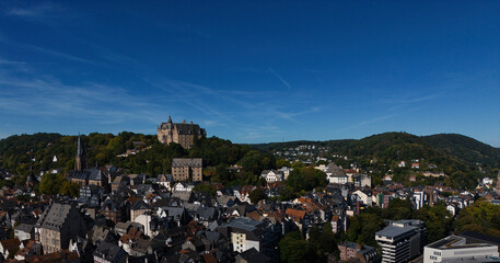 Aerial View of European City with Castle on Hill