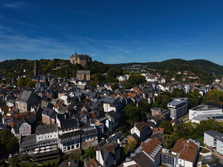 Aerial View of European City with Castle on Hill