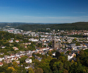 Aerial View of Town with Prominent Church and Lush Greenery
