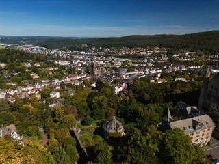 Scenic Town View with Lush Greenery and Hills