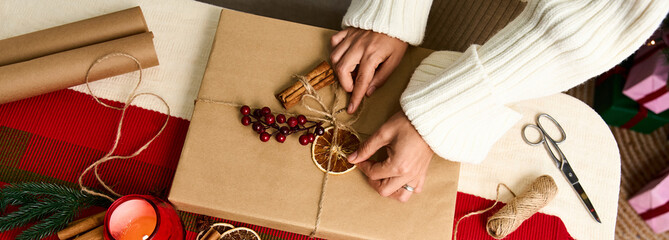 Crafting festive gifts with love during the Christmas season in a cozy setting