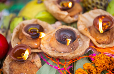 Holy offerings for hindu sun god at chhath festival with diya candle. Chhath Puja is a significant Hindu festival primarily observed in the Indian states of Bihar, Jharkhand, Uttar Pradesh and Nepal.