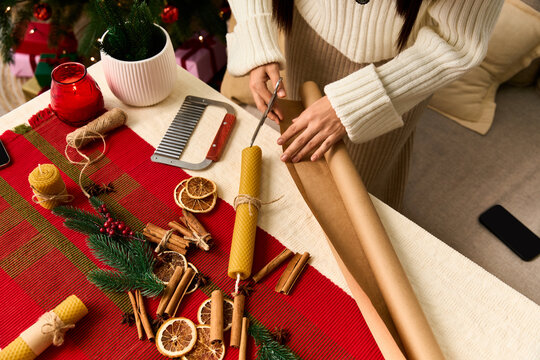 Creating handmade holiday gifts with natural decorations for Christmas celebration