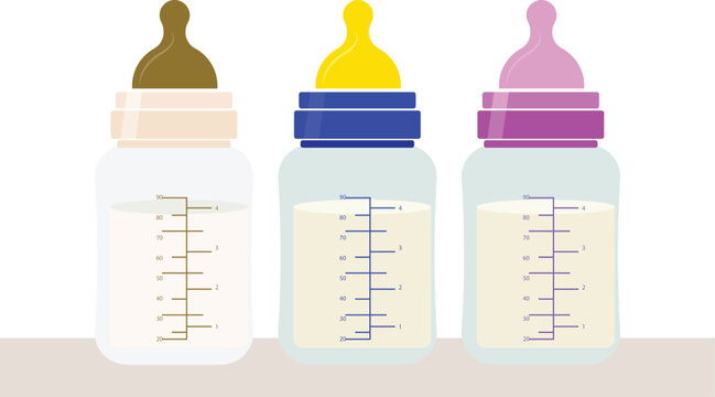 Three Baby Bottles With Different Colored Nipples And Liquid Levels milk formula