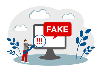 A man with a magnifying glass, a computer, fake information. The concept of fake information, propaganda and false news