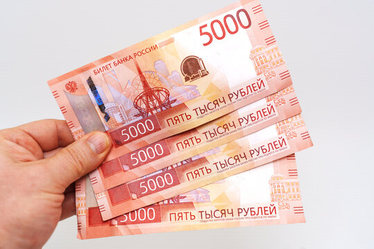 Stack of Russian 5000 ruble banknotes in hand