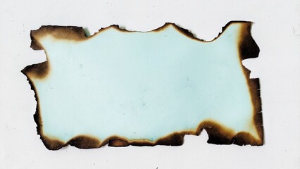 Paper piece with burned and scorched edges. Torn burn paper texture piece with dark burned border. Burnt paper isolated on white background with clipping path.