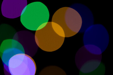 colorful bokeh lights on black background,abstract background of colorful bokeh lights,light leak overlay effect with rainbown bokeh ,Christmas xmas bokeh backgroug,glitter bokeh sparkles lights