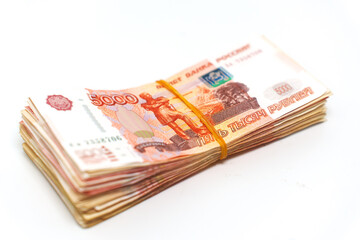 Stack of Russian banknotes on a white surface