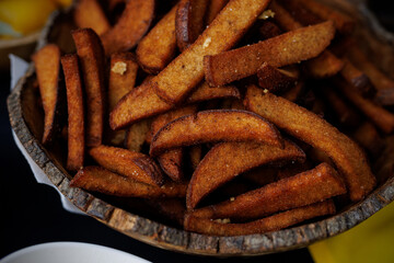 Crispy fried bread sticks in wooden bowl