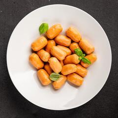 Sausage mini meat portion size fast food natural product tasty snack fresh delicious gourmet food background on table rustic top view copy space