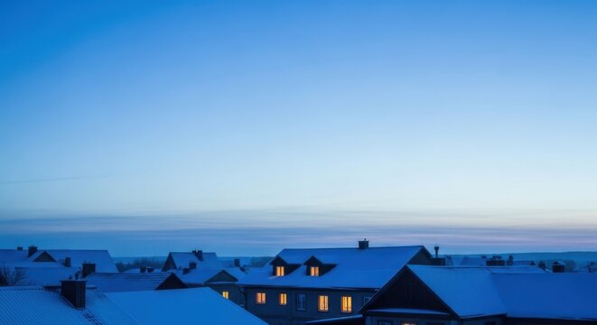 Blue hour over snowy village rooftops and a calm horizon - peaceful winter townscape for travel features seasonal greetings real estate banners and quiet headers with dependable copy space