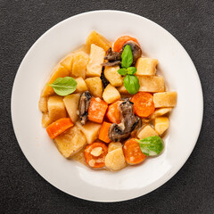 Potato stew mushrooms and vegetables natural tasty snack fresh delicious gourmet food background on the table rustic top view copy space keto and paleo diet vegerian and vegan food