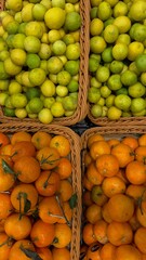 oranges and limes in baskets