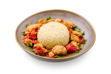 Delicious chicken and rice dish served on a round plate with fresh herbs