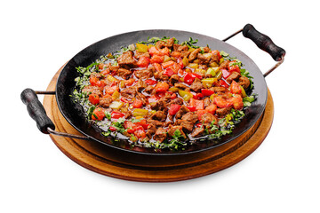 Colorful dish of meat and vegetables prepared in a skillet for a delicious meal