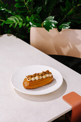 Delicious dessert served on elegant plate in a cozy cafe setting