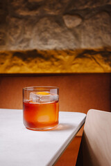 Classic cocktail served on a stylish table with warm lighting