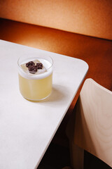 Refreshing cocktail on a stylish table in a cozy setting