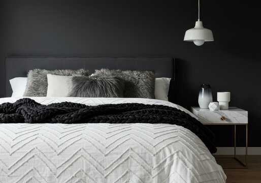Luxurious bedroom featuring a modern bed with dark walls and stylish accents