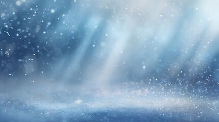 Abstract blue winter background with falling snow and light rays shining through