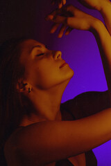 Moody Neon Portrait of Woman with Creative Lighting and Motion Blur