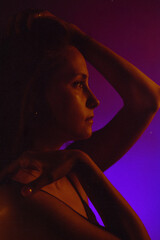 Moody Neon Portrait of Woman with Creative Lighting and Motion Blur