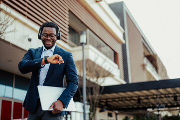 African american businessman using smartwatch in urban setting