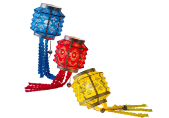Three colorful decorative paper lanterns hanging in a row against a dark background isolated on transparent background
