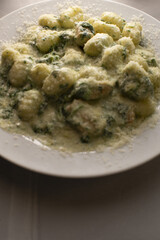 Herb dumpling pleasure, Creamy potato dumplings with basil cheese sauce, Velvety potato dumplings infused with herbs and topped with cheese and basil dressing