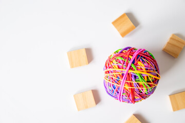 Colorful Rubber Ball Surrounded By Wooden Blocks