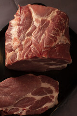Pork shoulder closeup, Studiolit raw pork detail, Highlighted raw pork with marbling texture, Studio shot of raw pork shoulder emphasizing marbling and texture