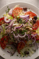 Fresh tuna paired with garden vegetables and herbs, Diverse assortment of plantbased seafood creations accompanied by fresh herbs and vegetables on rustic style