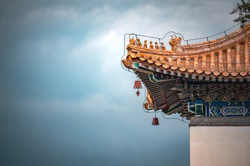 Close up view of an ancient building in Beijing, China, showcasing intricate details. The Summer...