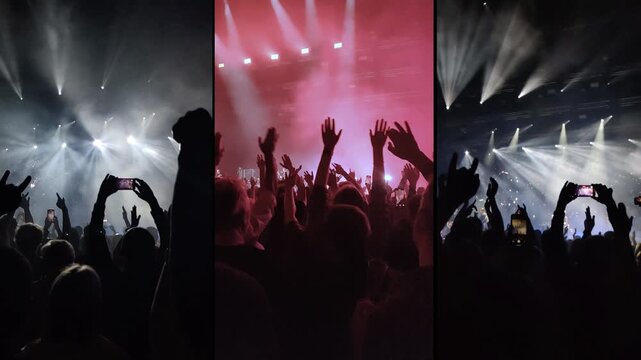 Clapping hands of people at a concert under spotlights.	