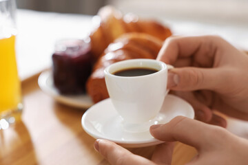 Man having breakfast in bed, closeup. Hotel room service